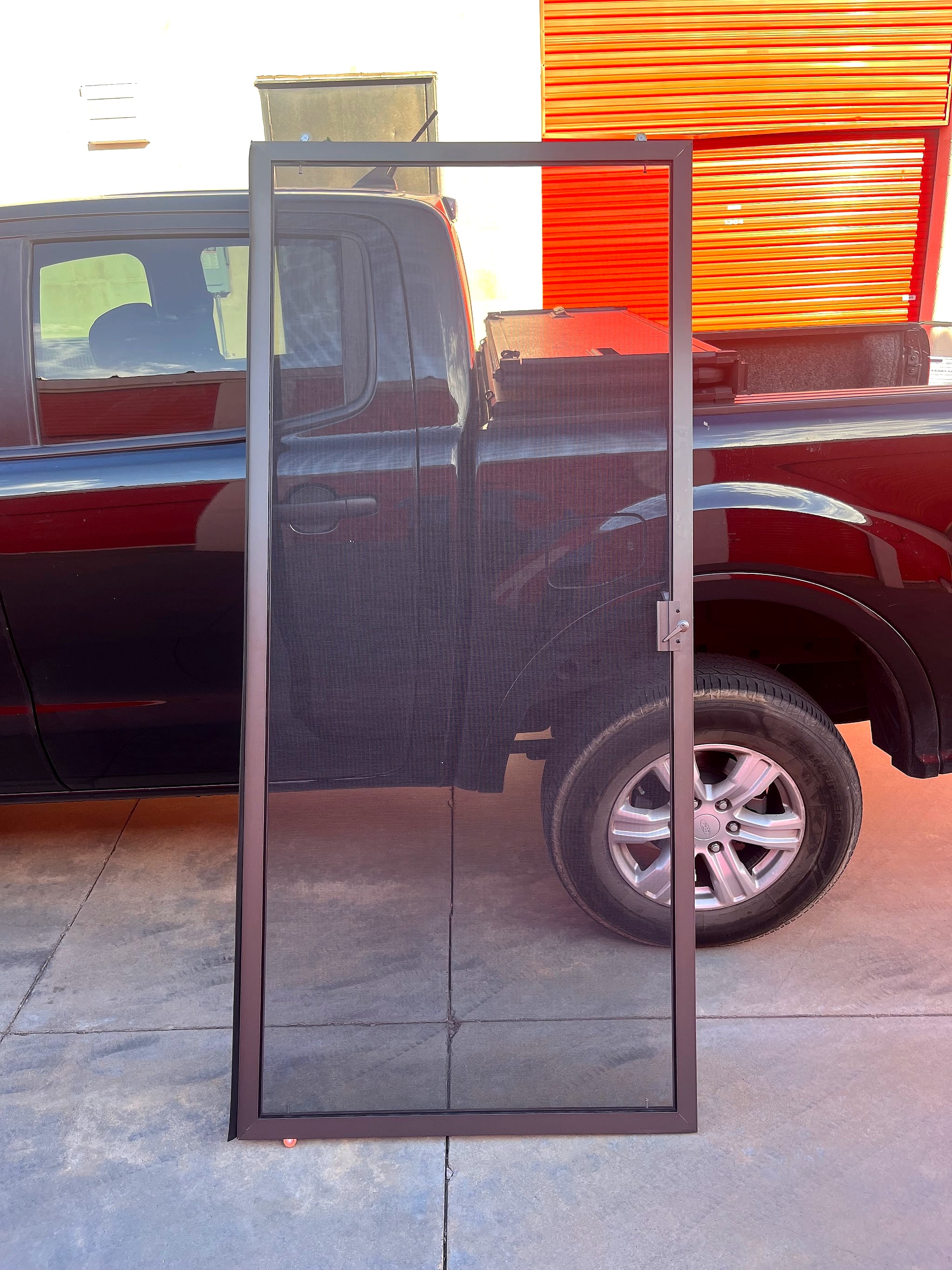 New screen door leaning against the 10X work truck