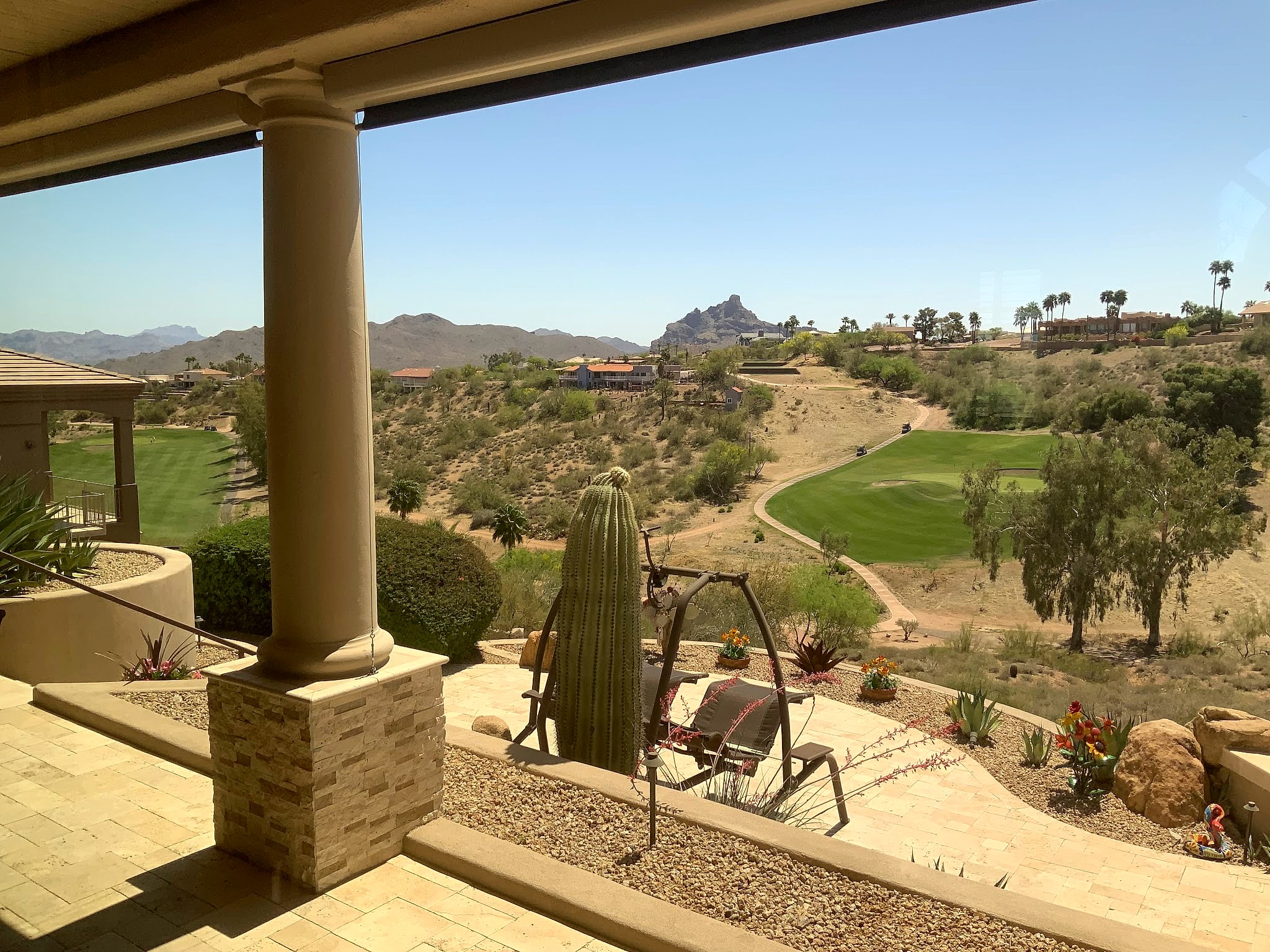 Patio view of a golf course and the Four Peaks range